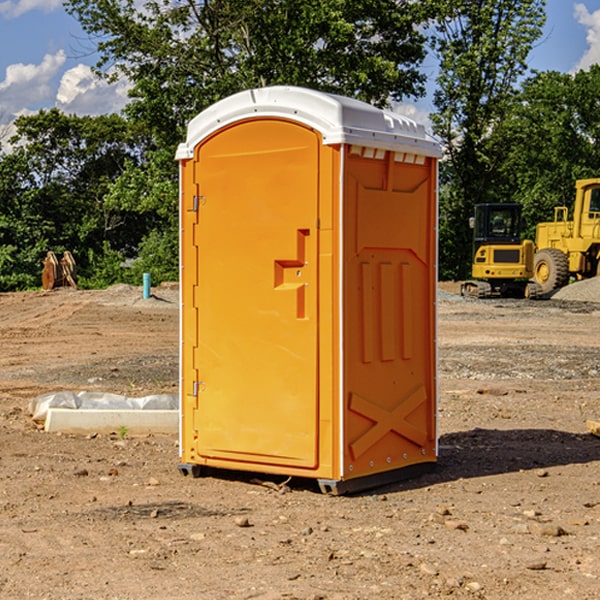 what is the cost difference between standard and deluxe portable restroom rentals in Metz